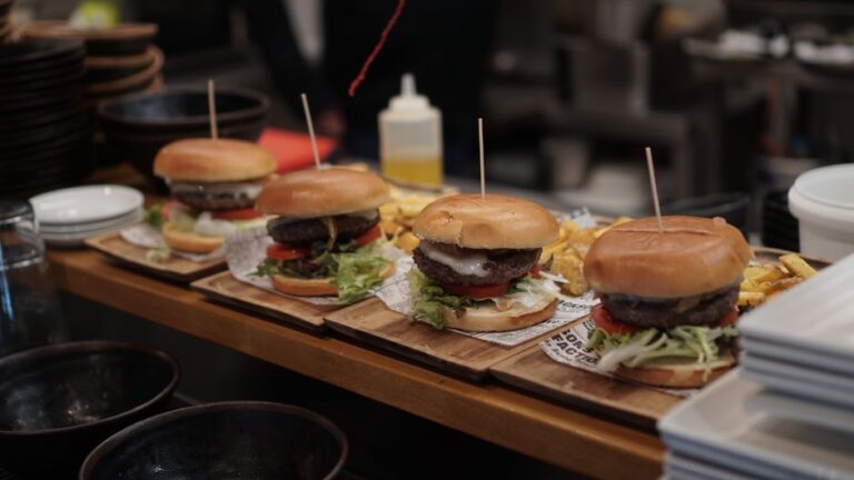 A gourmet burger served with fries