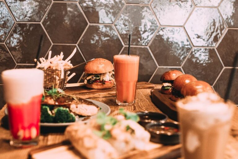A milkshake beside a burger