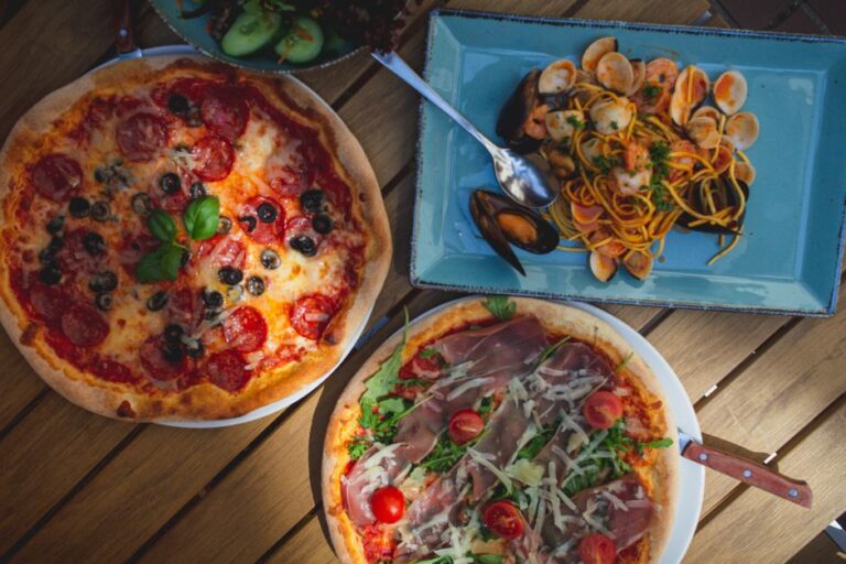 An Italian table with pasta and pizza