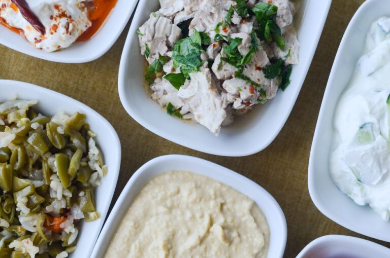 Garlic sauce and pickles in small dishes